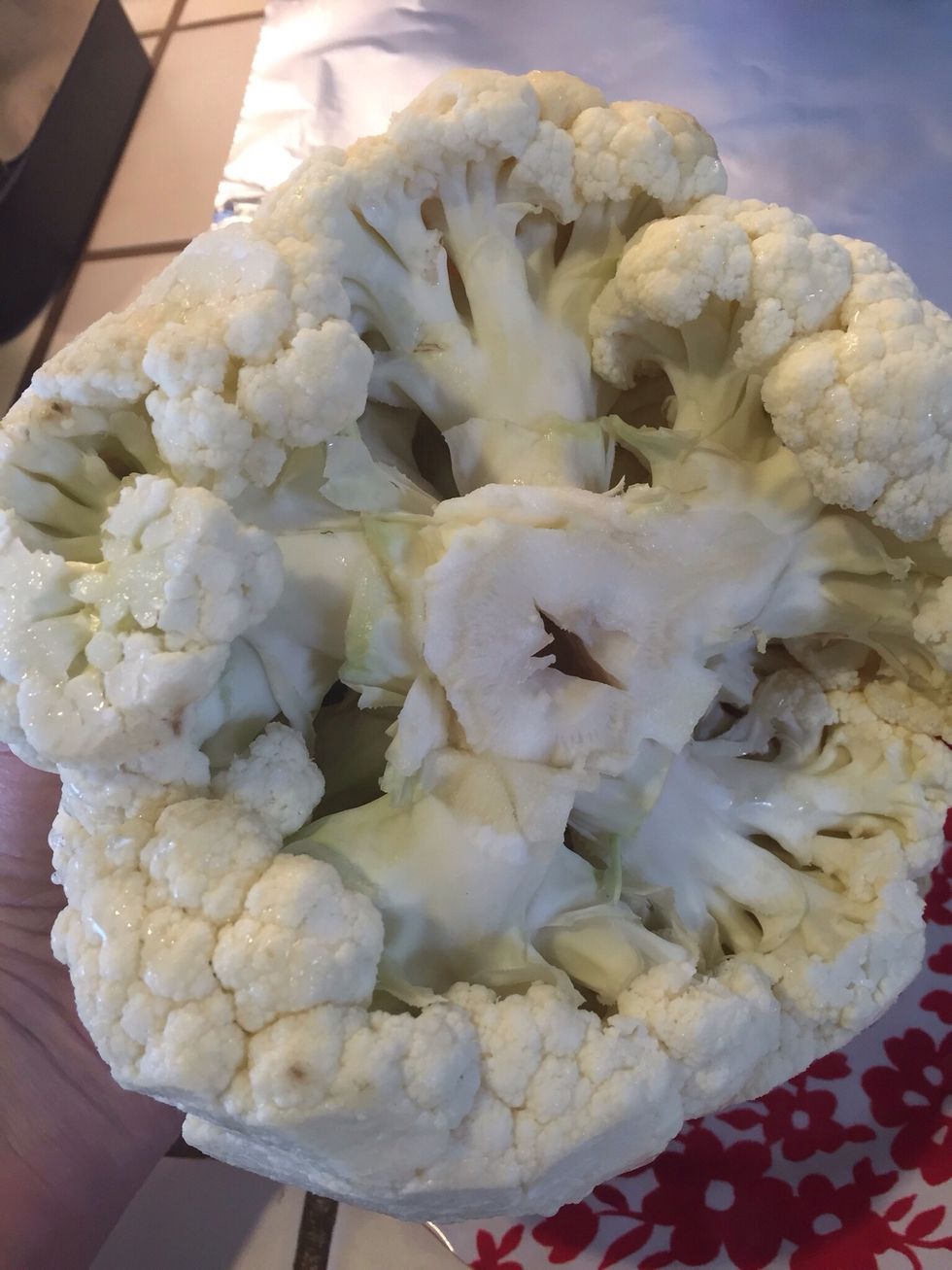 Cut off leaves and stem of cauliflower, make sure not too much, you want to keep head in tact.
