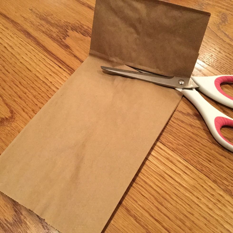 Cut off the bottoms of your brown paper bags. Make sure you have enough bags for each letter plus two extra.