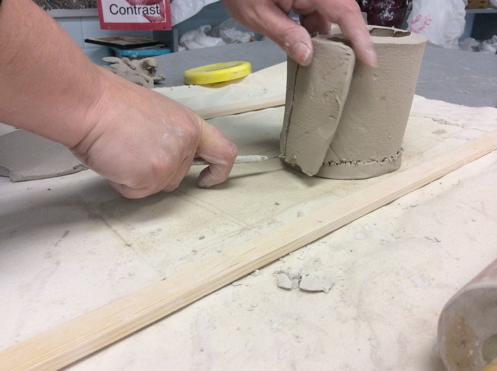 Cut off the excess clay.