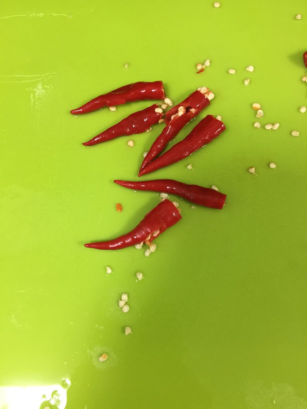 Cut off the stem and smash the birdseye chillies
