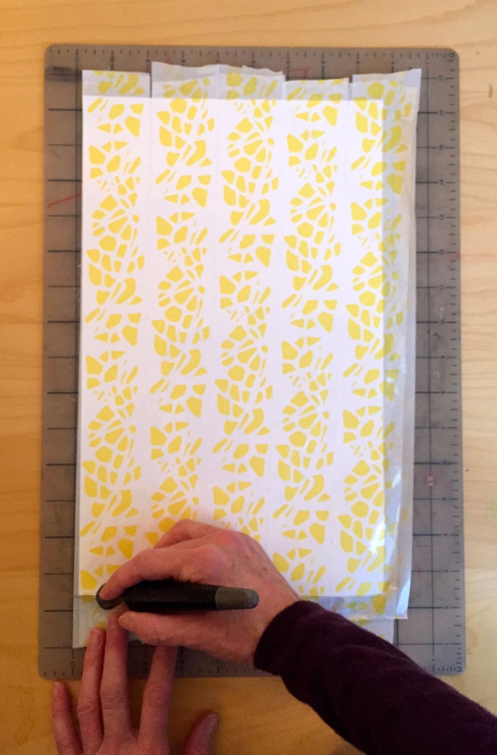 Cut off the tape outside of the paper because it is difficult to cut using a punch and you do not need it.