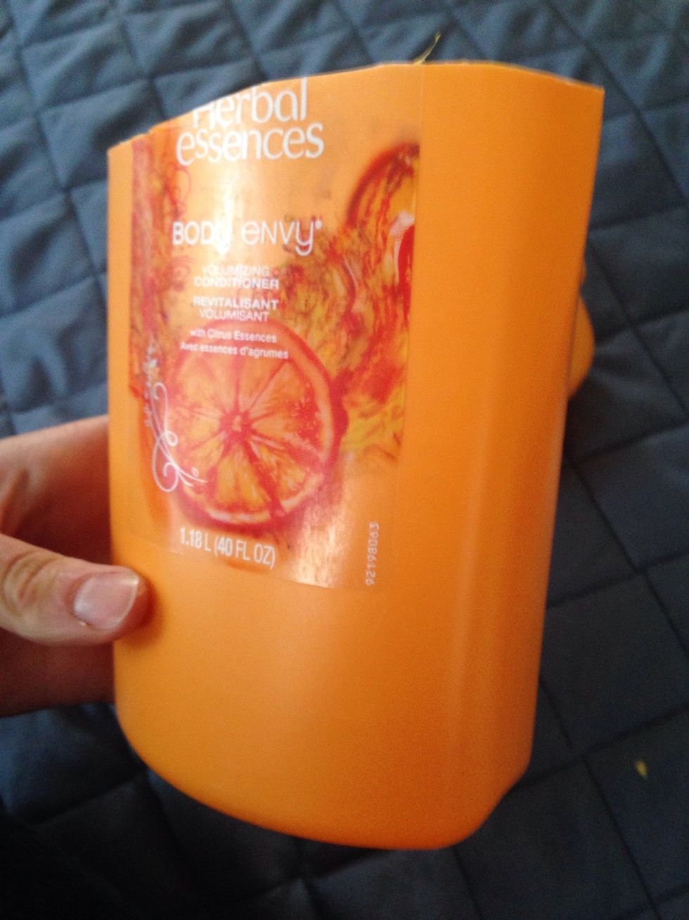 Cut off the top about 1/3 down from the top of the bottle.