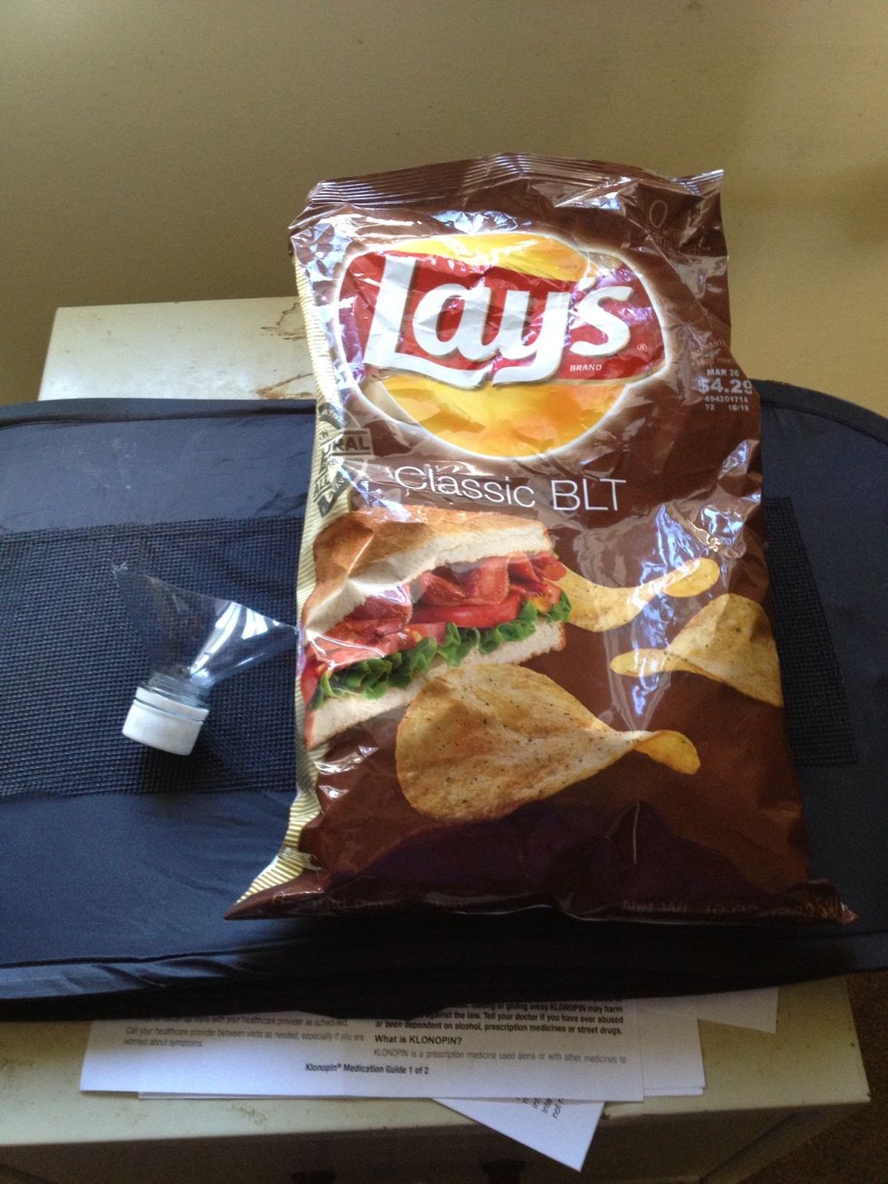 Cut off the top off a pop bottle. Can be two litter or smaller depending on snack bag size. Grab your bag of chips or whatever. Here I am using Lays Classic BLT potato chips!