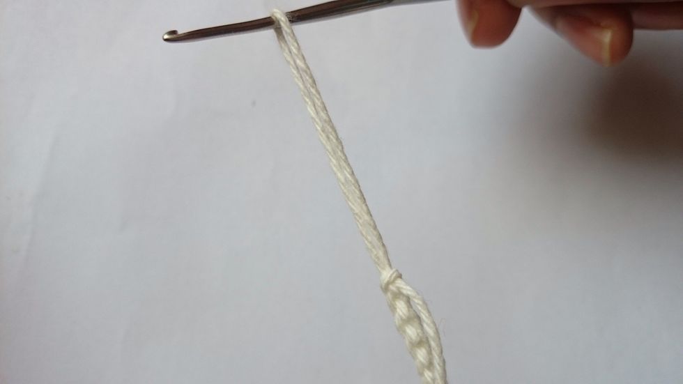 Cut off the yarn,leaving a tail and pull it through.