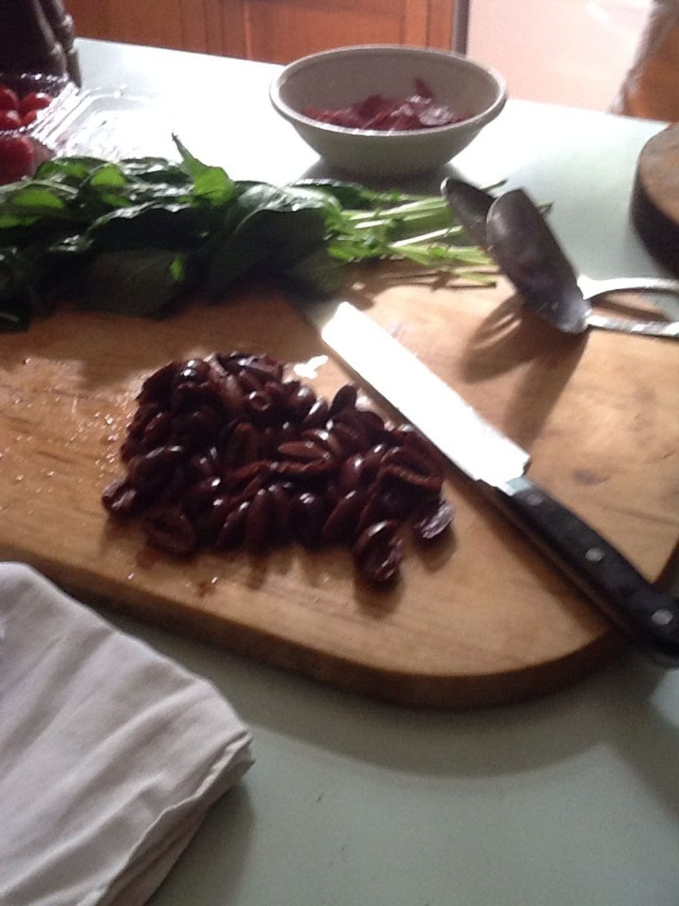 Cut olives into halves