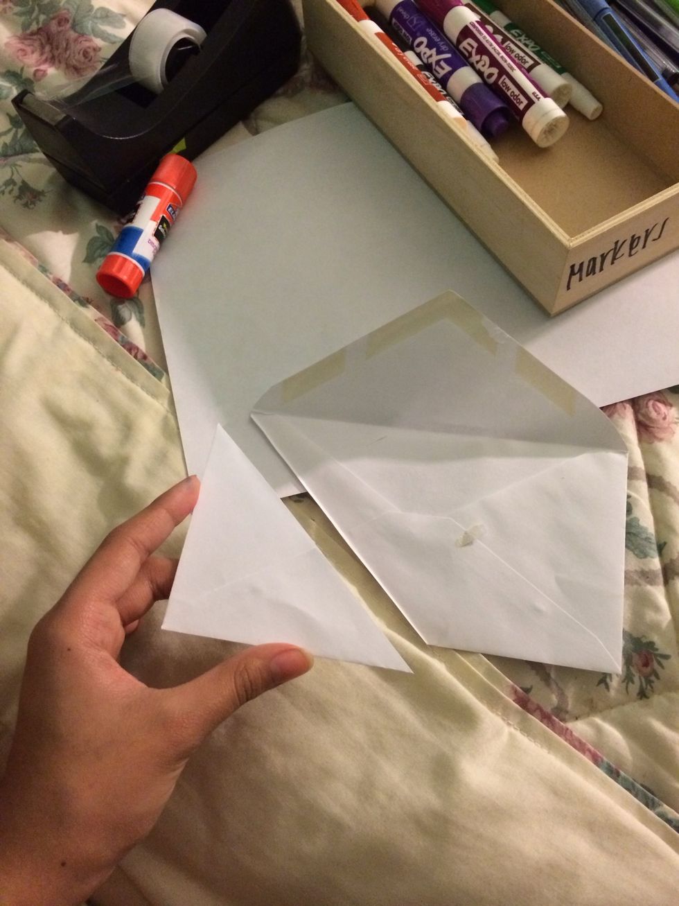 Cut on the folded line, And you will turn out with a closed triangle