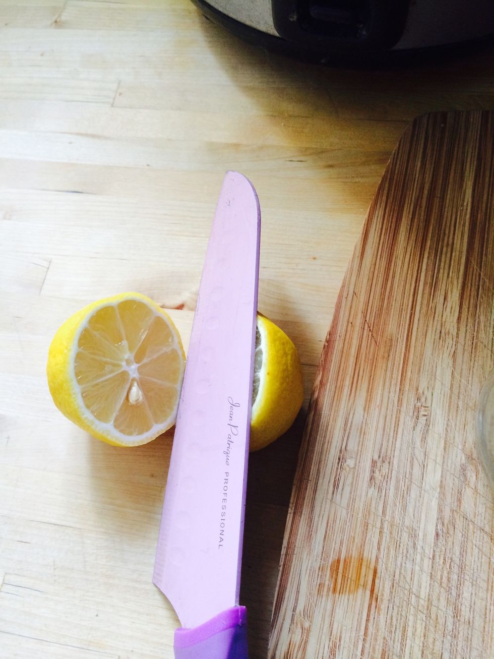 Cut one lemon in half