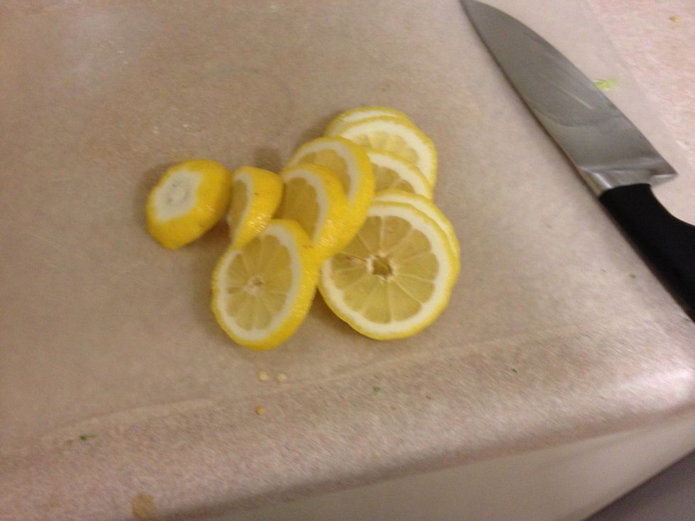 Cut one lemon into slices and put in in pitcher try to pick out the seeds Cut up the limes as well