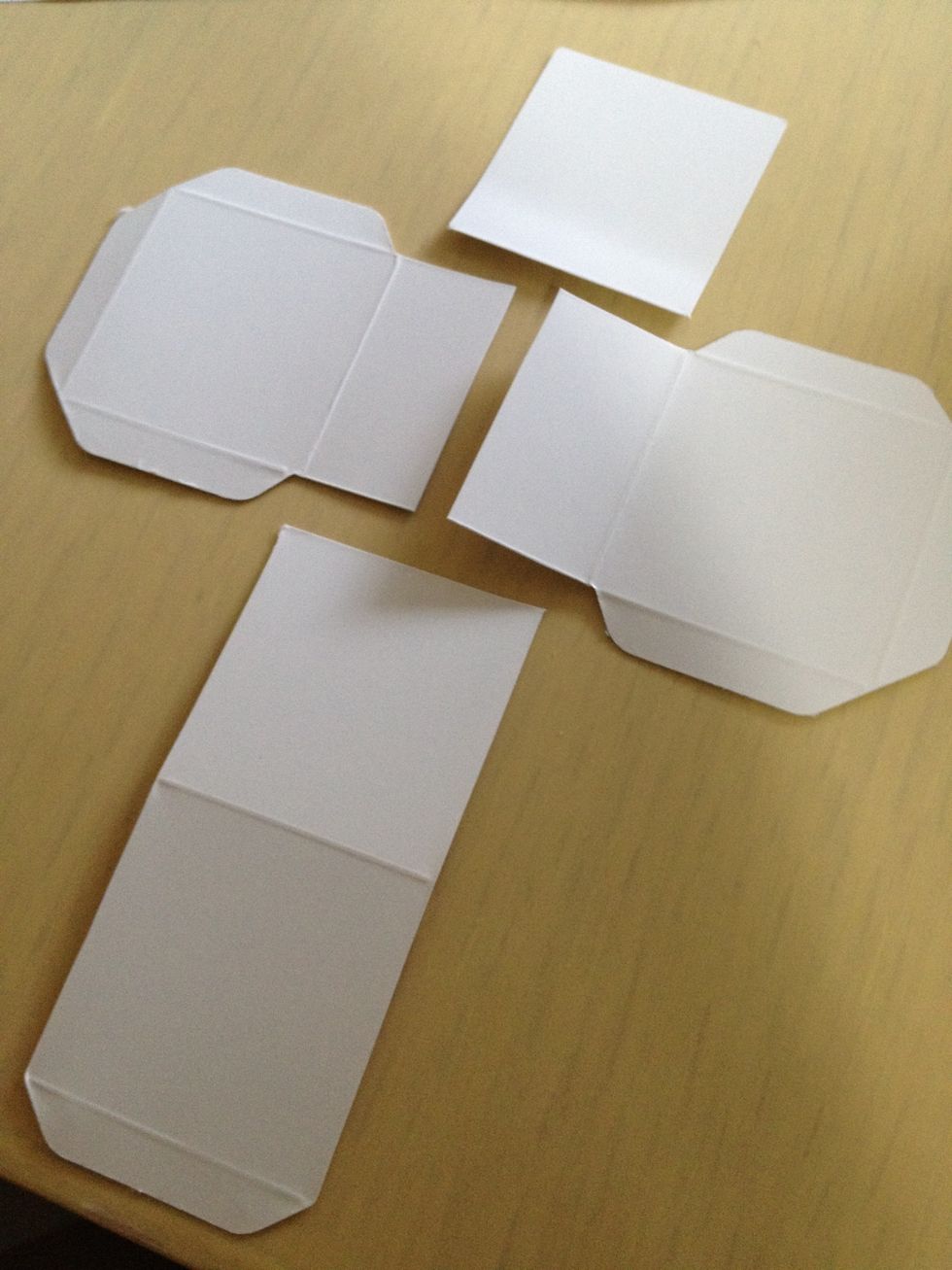 Cut one visual art playing block paper as shown. Those are the ears and tail of the dog.