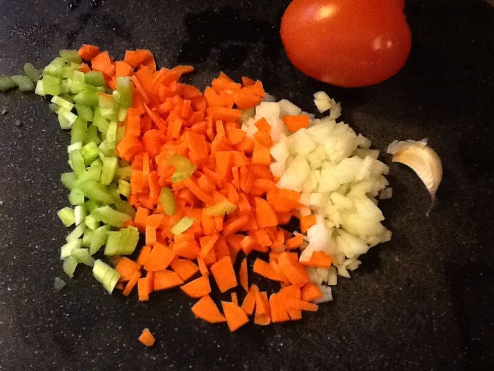 Cut onion, carrot, celery into small pieces, Cut tomatos and garlic cloves
