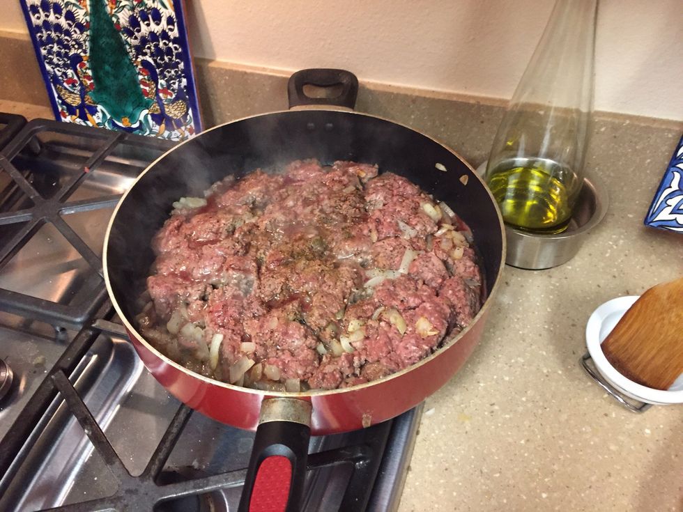 Cut onions, add meat and onions to skillet. Let the bottom brown, then mix up he meat to let the top brown and cook through.