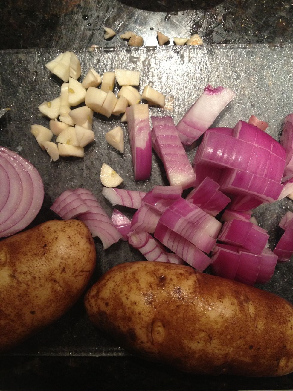 Cut onions and garlic. Cut potatoes into slices or cubes. Leave the skin on if you prefer.