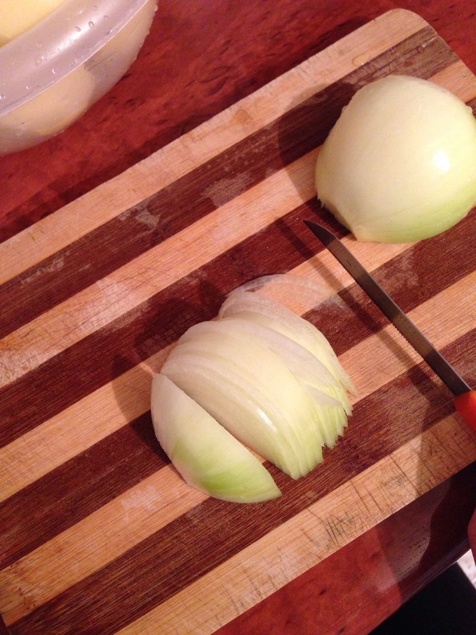 Cut onions into semicircle and put into the hot pan
