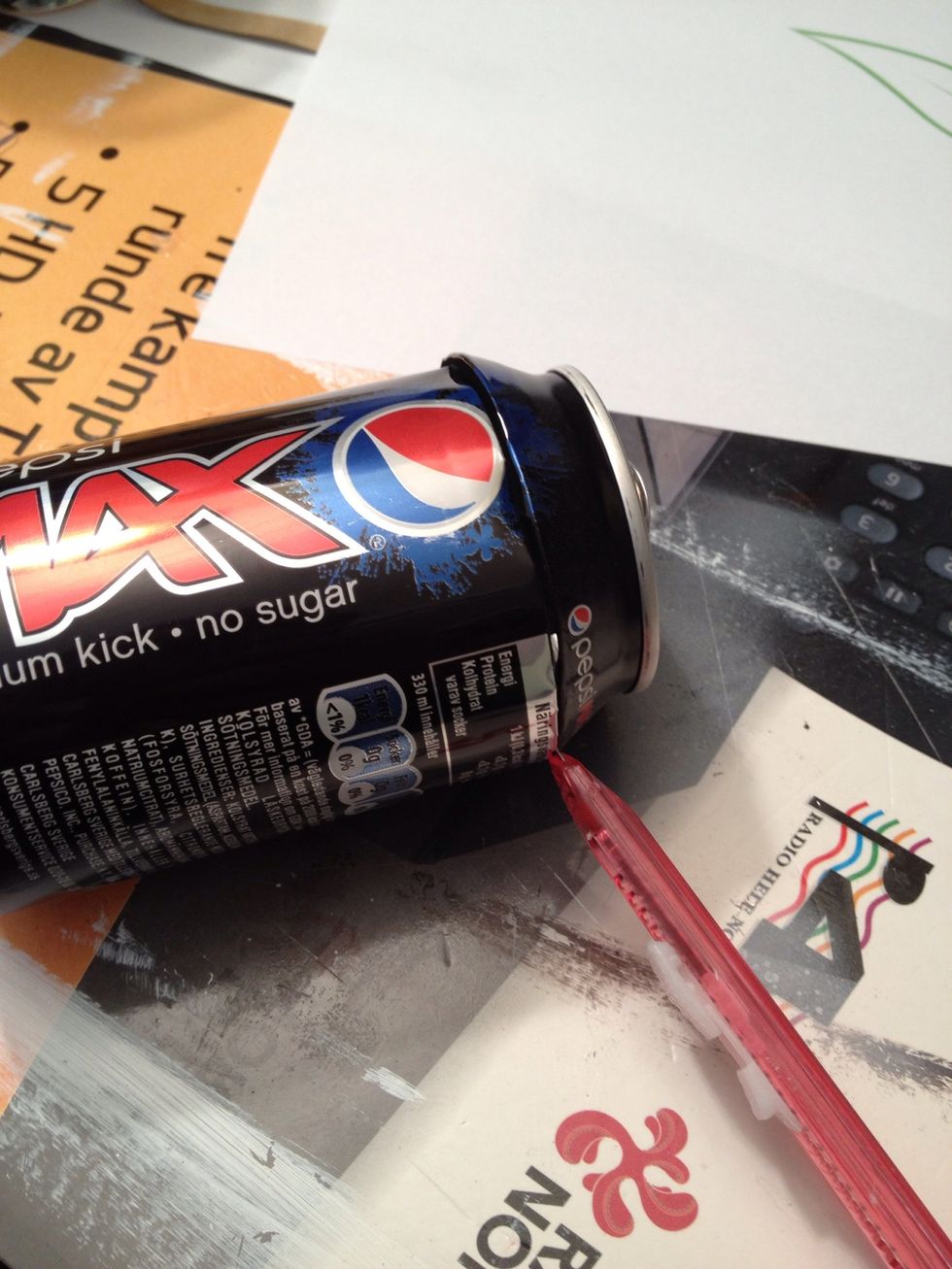 Cut open a soda can