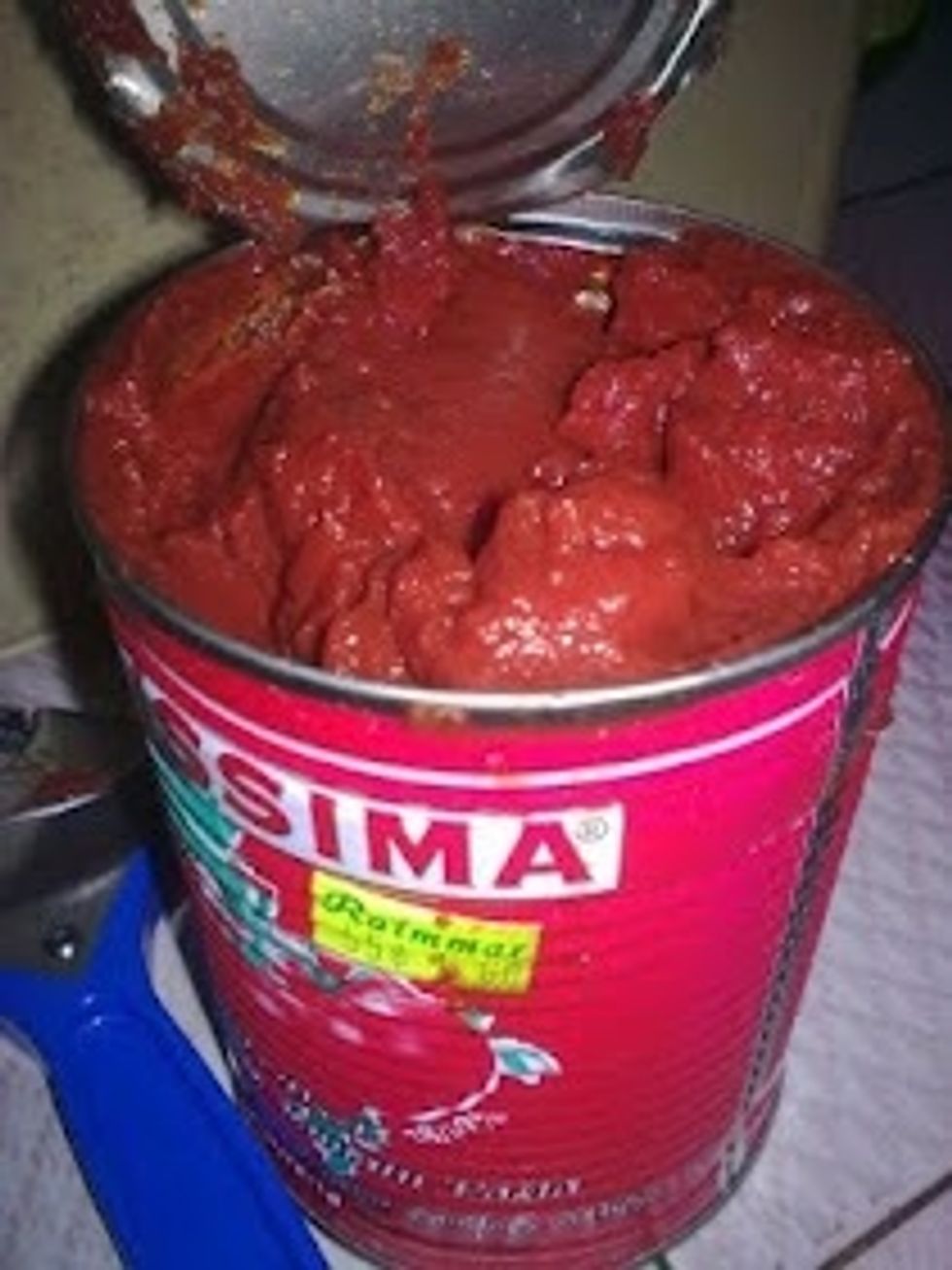 Cut open the Tomato Paste.