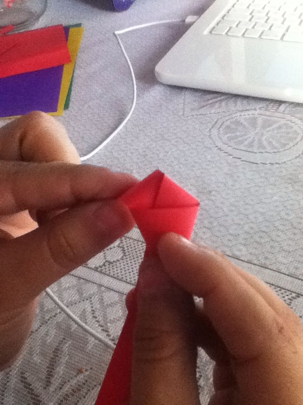Cut or bend the tie, then you'll have a sort of pentagon
