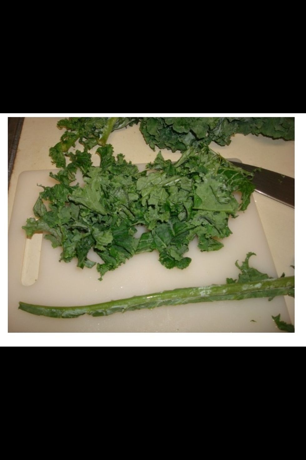 Cut or tear the kale leaves away from the center rib.  It pulls apart easily so a knife will not be needed.