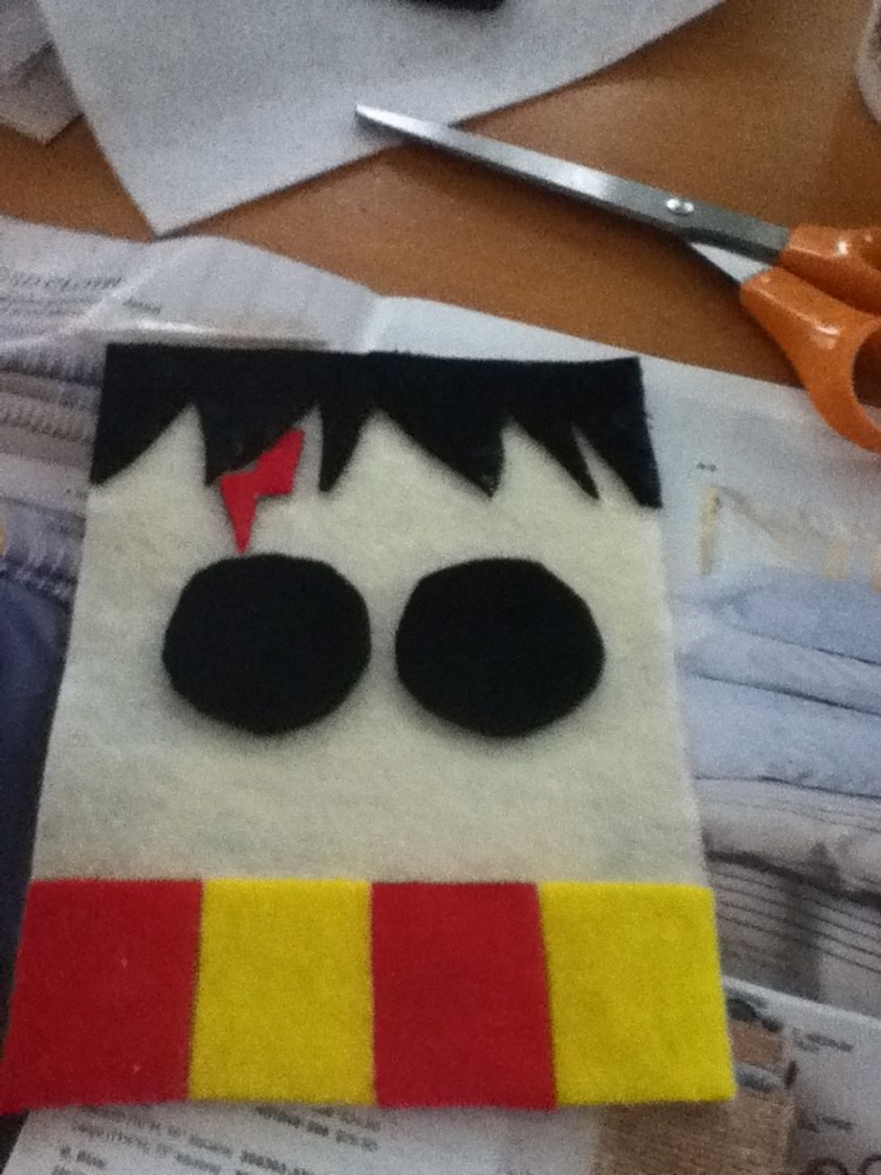 Cut out 2 black circles for his glasses and cut holes in the cwnter