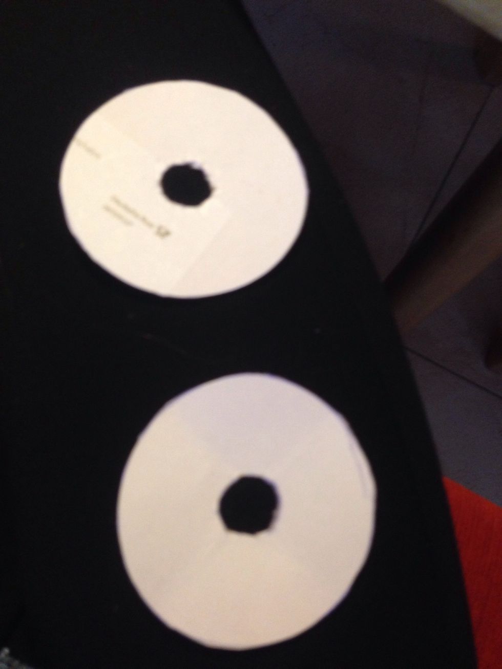 Cut out 2 circles with a hole. Use thick paper