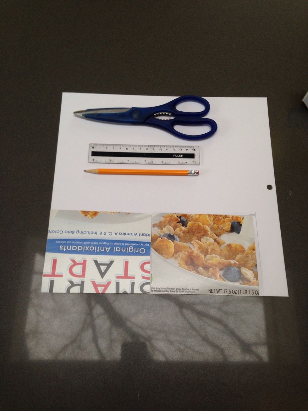 Cut out 2 pieces of cardboard that are slightly larger than your papers. Then, cut a piece of decorative paper slightly (1/8") longer than your 2 card boards.