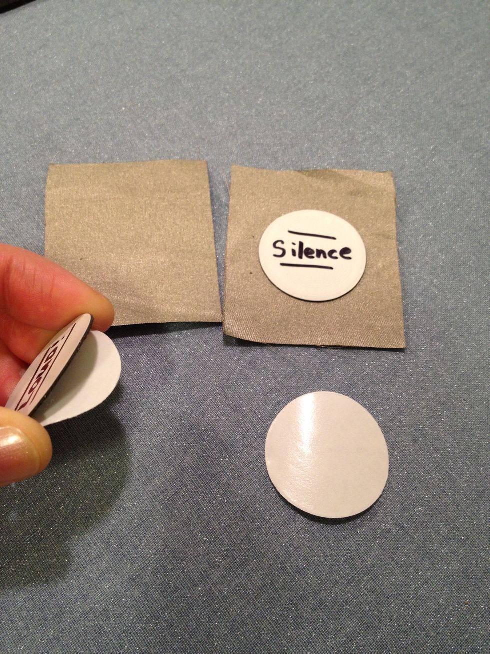 Cut out 2 small squares of this fabric. Take your "quiet" NFC tag and peel off the sticker backing and place it onto one piece of fabric. Put "loud" onto the other.