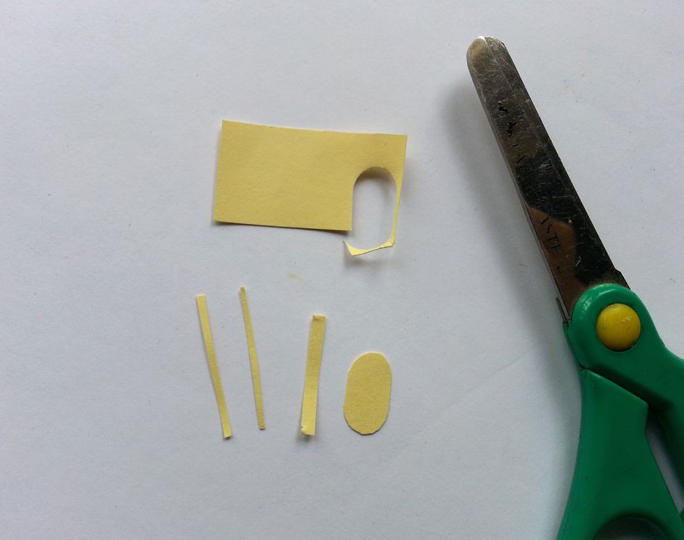 Cut out 4 pieces of papers as shown in the picture. 2 for the antennas, 1 for wrapping both wings together and 1 for the body (respectively).