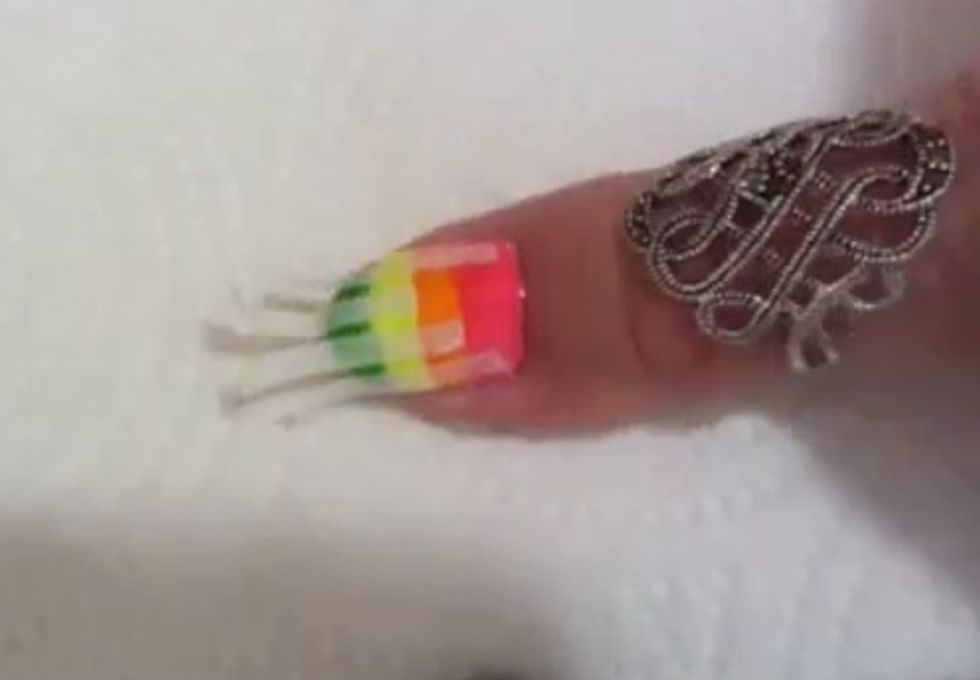 Cut out 4 small stips of tape an apply to nails ^as shown above.