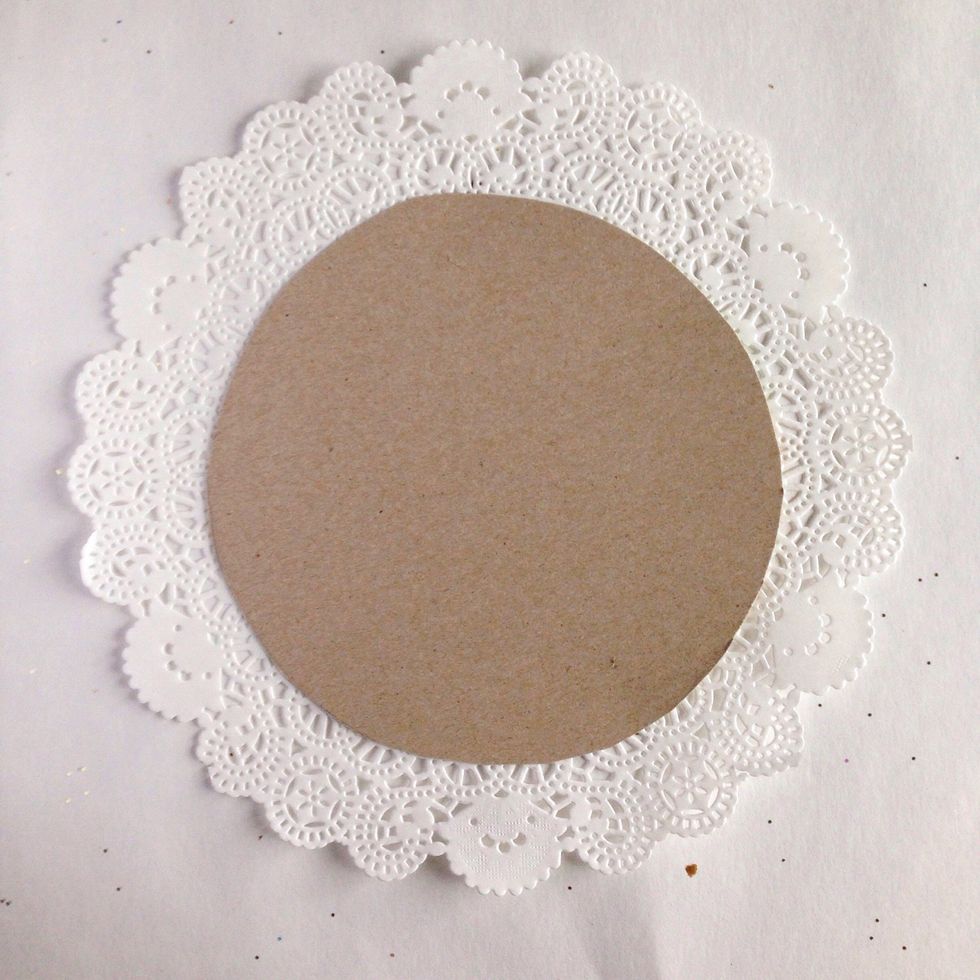 Cut out a circular piece of cardboard (I used a cereal box) that is the size of the center circle of the doily.