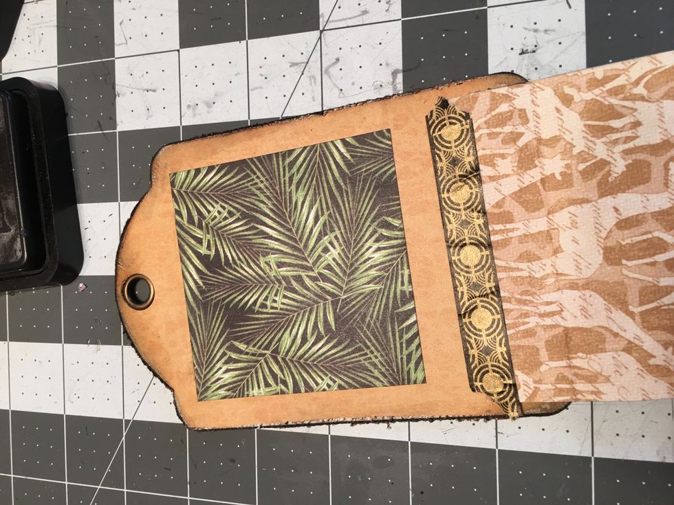 Cut out a piece of patterned paper to create a photo mat to cover the magnet on the tag side. Cut a tag about 3 1/2" x 3 1/2" square. Attach down over the magnet.