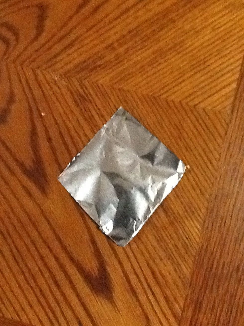 Cut out a piece of tin foil.