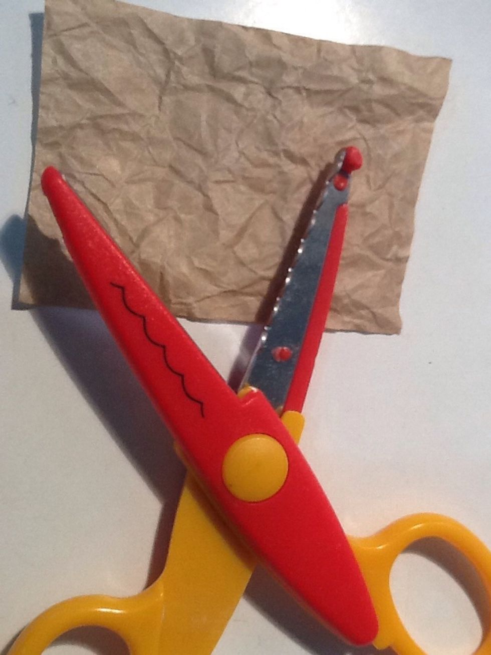 Cut out a rectangle to fit the inside of card, as well as leaving room for a border. Using a decorative edge scissor, cut out the border.