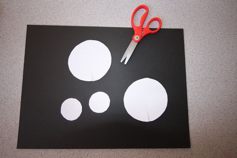 Cut out a simple shape (circle, square, rectangle, or triangle)from white copy paper.  Continue cutting the same shape in various sizes until you have between 30 and 40 shapes.