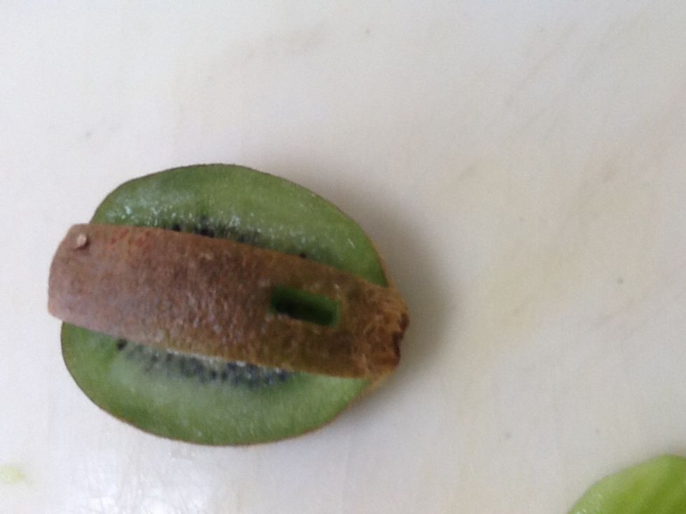 Cut out a small hole towards the front that will fit the head in it. Remember that it is better to have a hole to small than too big.