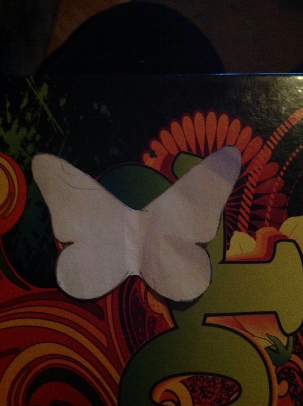 Cut out all the butterflies. Then using liquid glue and a paint brush. Cover the top of each butterfly in glue. When all the butterflies are dry, place a 3 D dot on each.