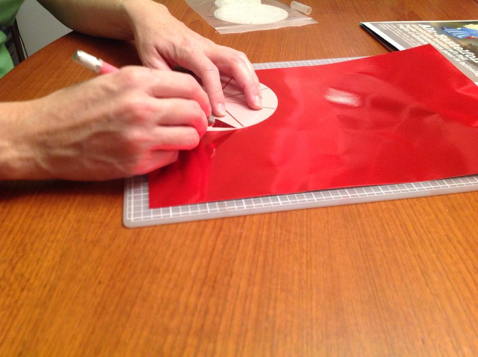 Cut out circles using your exacto and a self healing mat. Or scissors. No big deal here. Then make eight equal "pie slice" divisions. Just don't cut to the center! Leave a good inch in diameter.