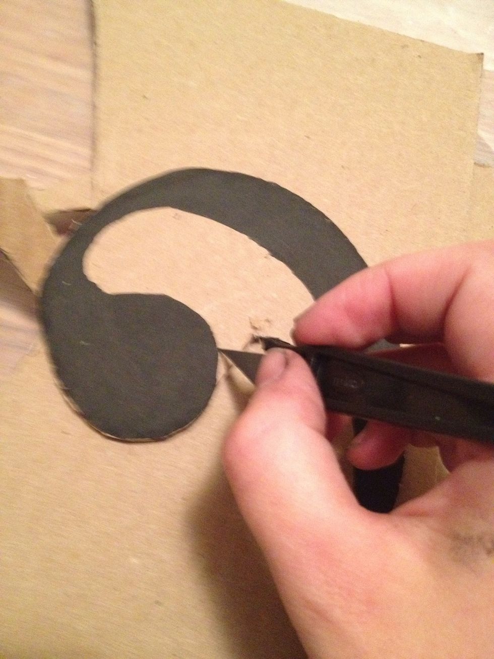 Cut out decal with scissors in easy spots and x-acto knife in tricky areas. Cardboard and foam board are difficult to cut through. Use caution. Set aside.