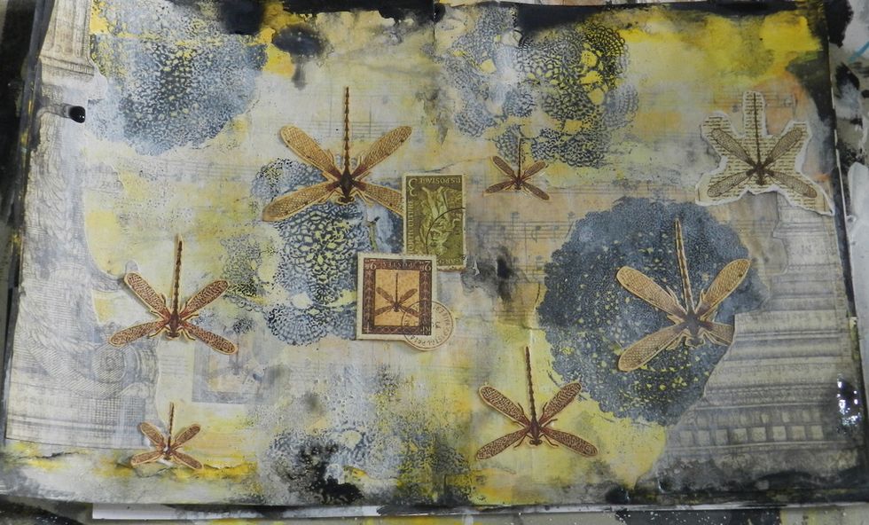 Cut out dragonflies from G45 Botanicabella collection and glue .them on the pages,