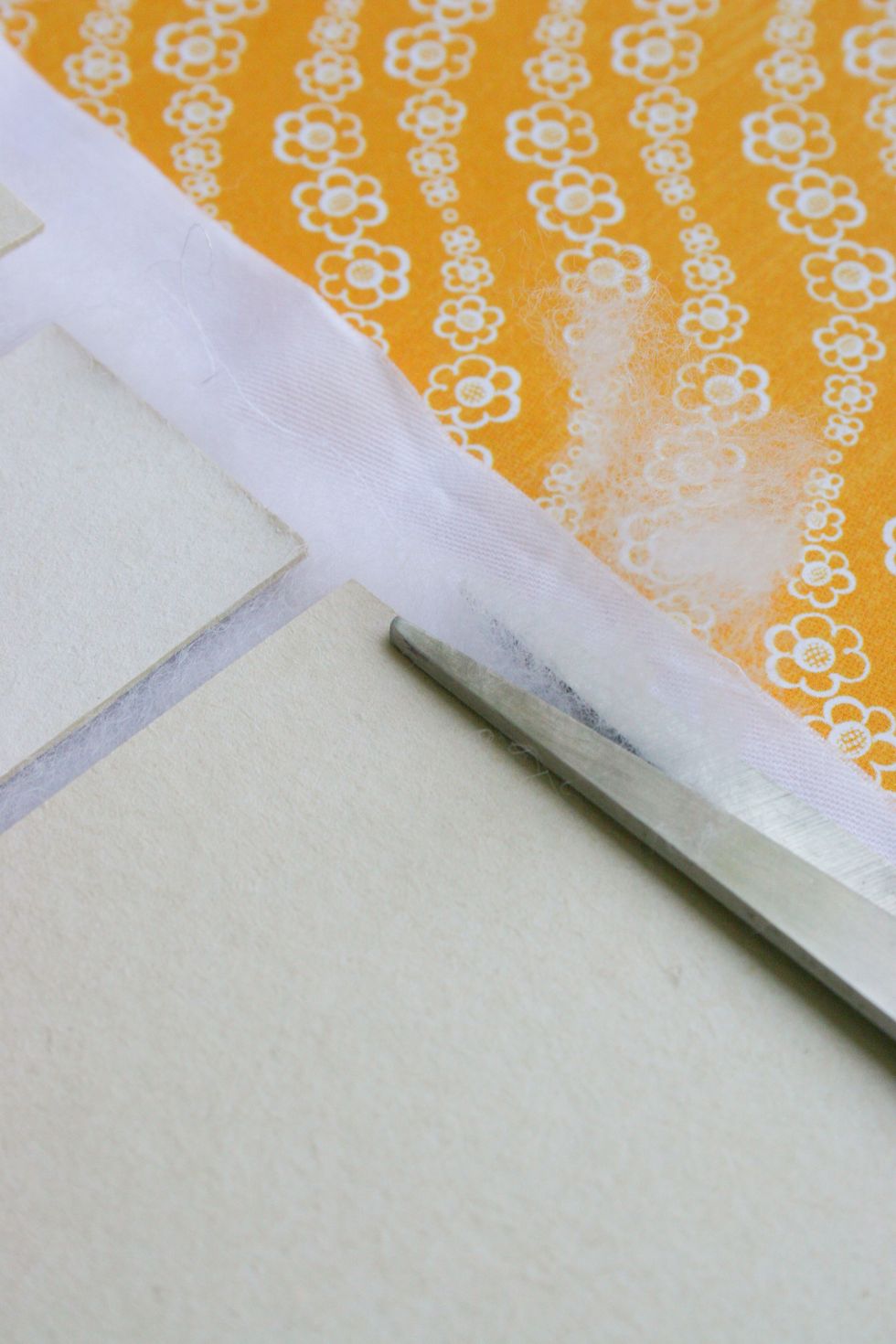 Cut out excess padding polyester.