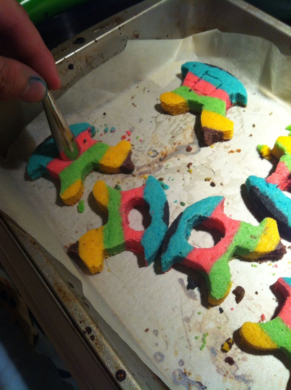 Cut out holes in the THICKER slices so that you can fill them with candy after