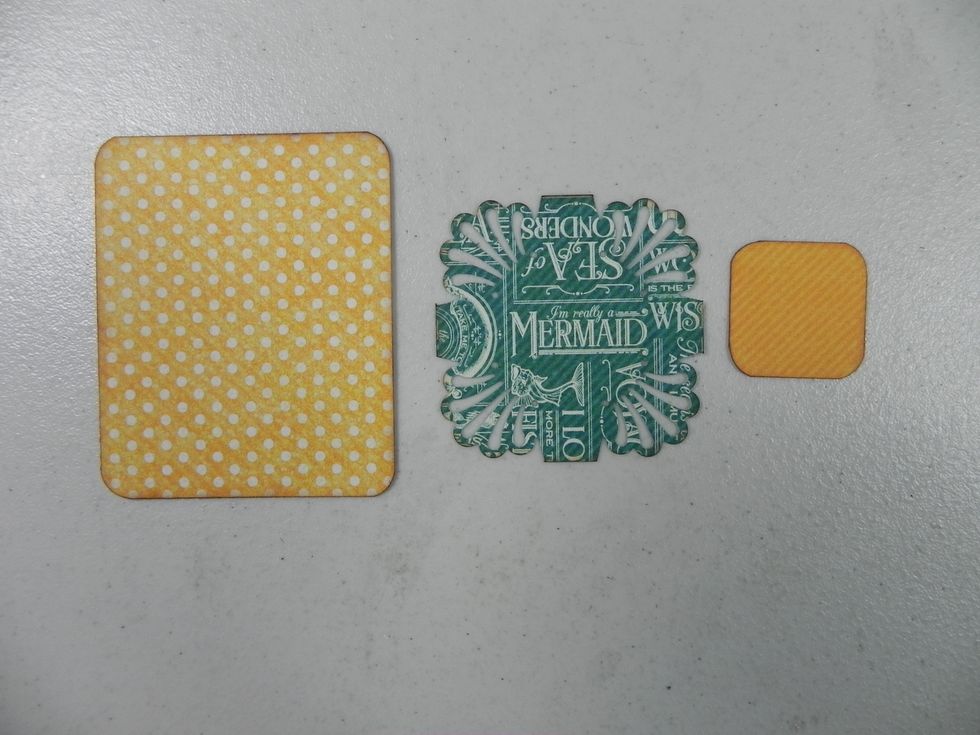 Cut out of pattern paper: 2 1/4 x 2 3/4" - Punch with 1/4" corner; 2 x 2" - Punch with Martha Stewart Deco Shell; 1 x 1" - Punch with 1/4" corner. Ink edges. (For one tag, repeat for all 6)