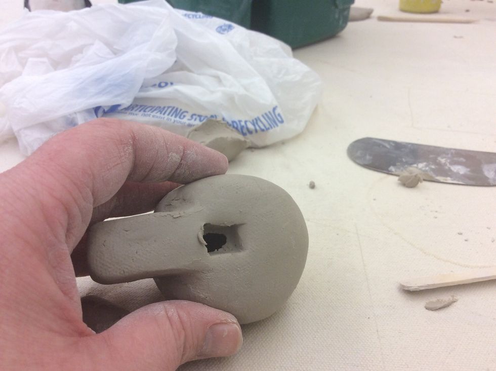 Cut out opening. Notice the clay that is ragged on the edges.