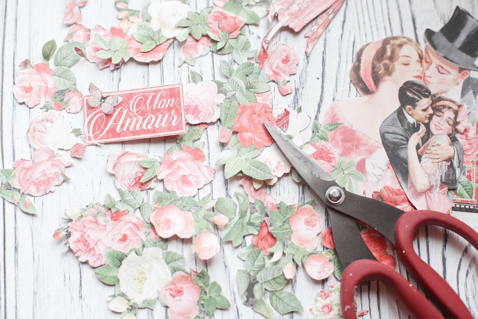 Cut out some flowers, buterflies, leaves, pictures and titels.