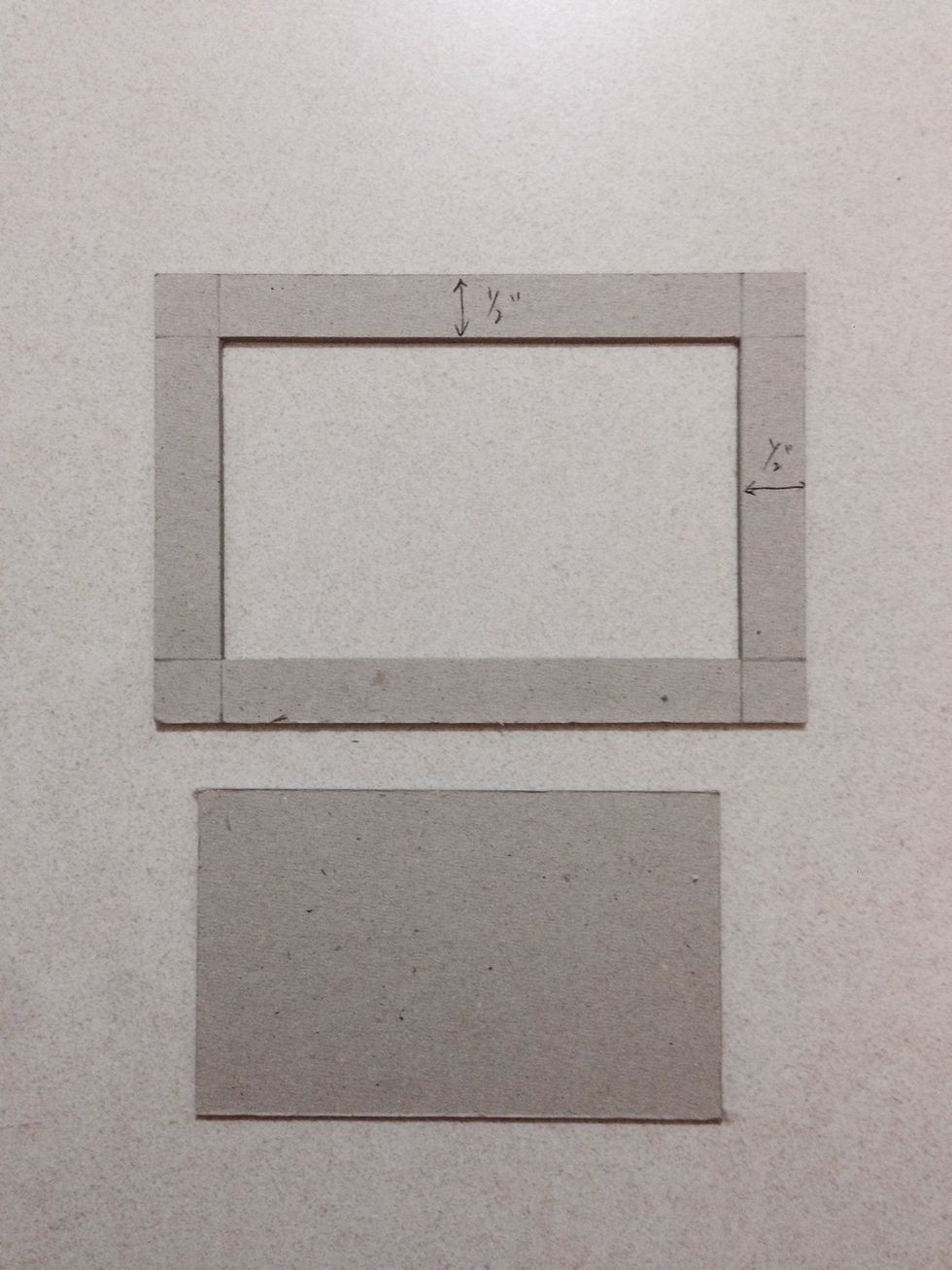 Cut out the centre piece, giving you a chipboard frame and a rectangle... Discard the rectangle away and keep the frame aside...