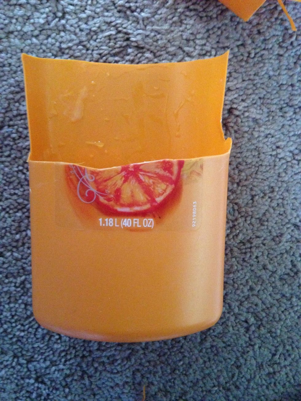 Cut out the front section of the bottle, as pictured. You can probably do better than I did!!;)