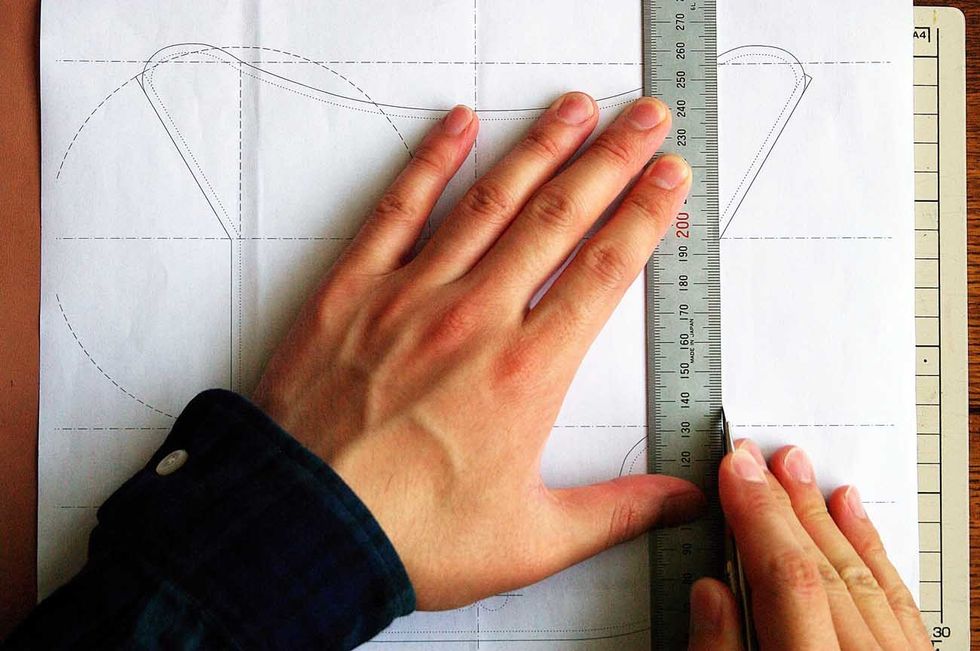 Cut out the leather with a leather cutter.  Be careful not to cut your fingers!