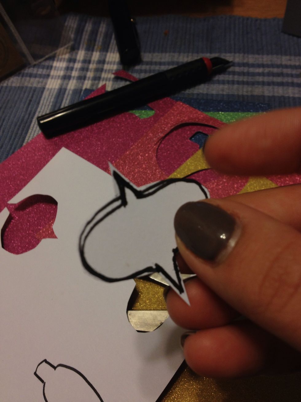 Cut out the outline. This is just a guide instead of cutting freehand and having misshaped cutouts.