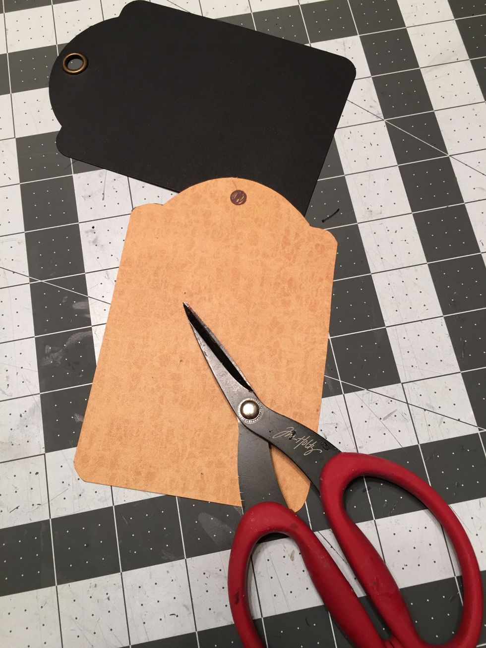 Cut out the paper with scissors.