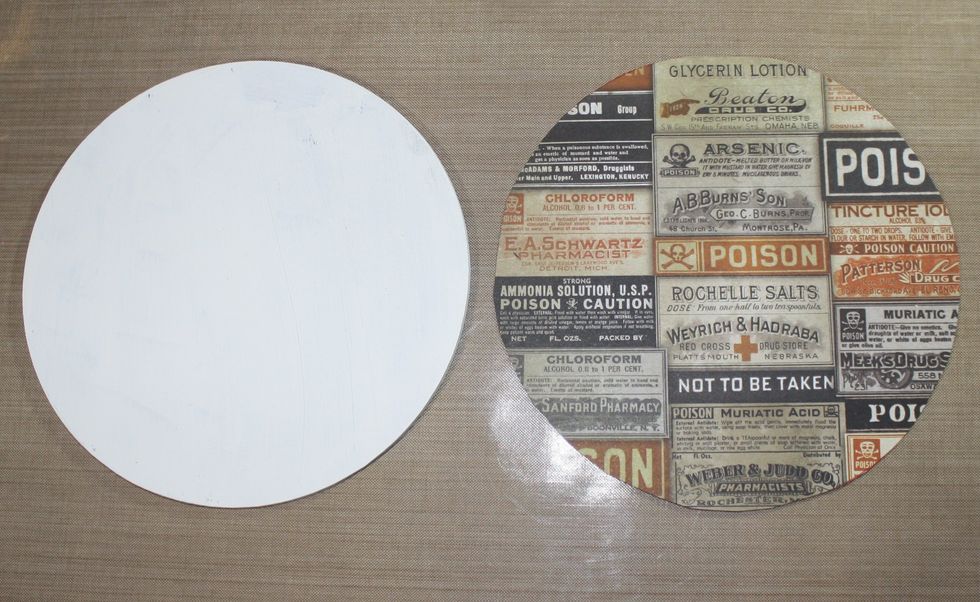 Cut out the scrap paper to the size of the back of the large circle frame.