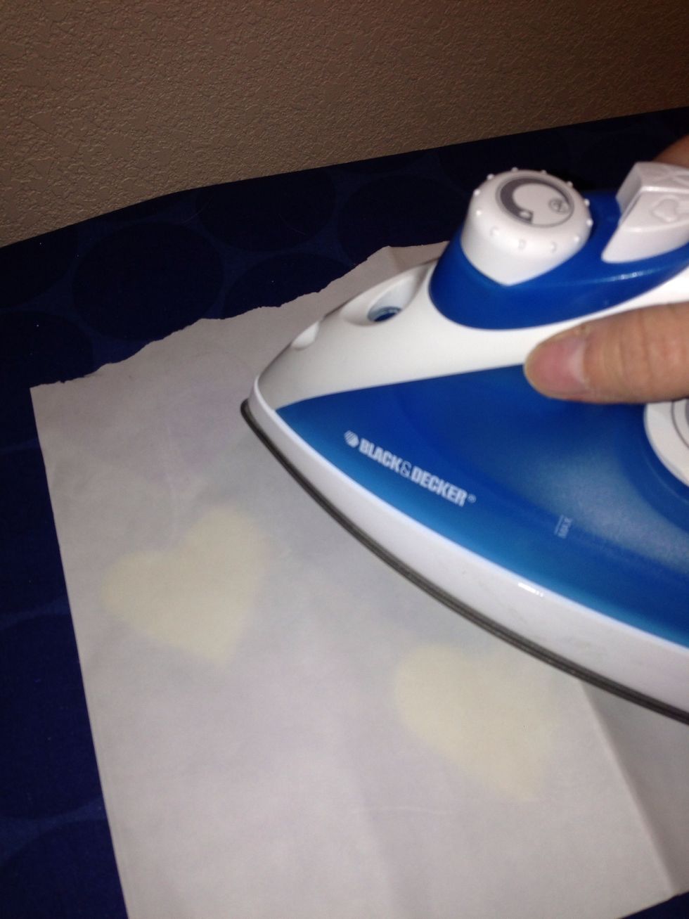 Cut out the shape from felt you wish to appliqu\u00e9 and apply the fusing by placing the felt face down and ironing the fusing against it. Use a paper towel underneath the felt object for easy cleanup