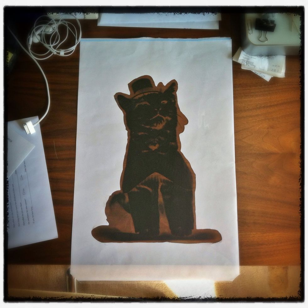 Cut out the shape to make a stencil. This will also be used as a mask during the exposure. Compare it to the negative. Make any adjustments. Register the two sheets by snipping the corners together.